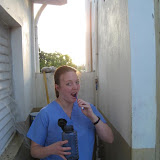Lauren brushes her teeth the next morning in the community "bathroom".