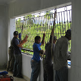 The team putting in the BEAUTIFUL iron burgler bars.