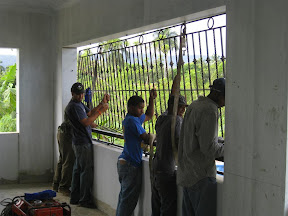 The team putting in the BEAUTIFUL iron burgler bars.