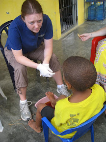 Lauren consults with a student about a toe injury.