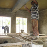 Buckets of mezcla (plaster mixture) go on the ceilings.