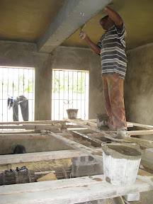 Buckets of mezcla (plaster mixture) go on the ceilings.