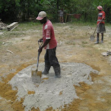 Step 4: Spread the cement out on top of the sand