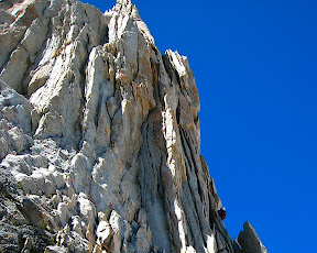 Tom cruising up the steep flakes on pitch 2