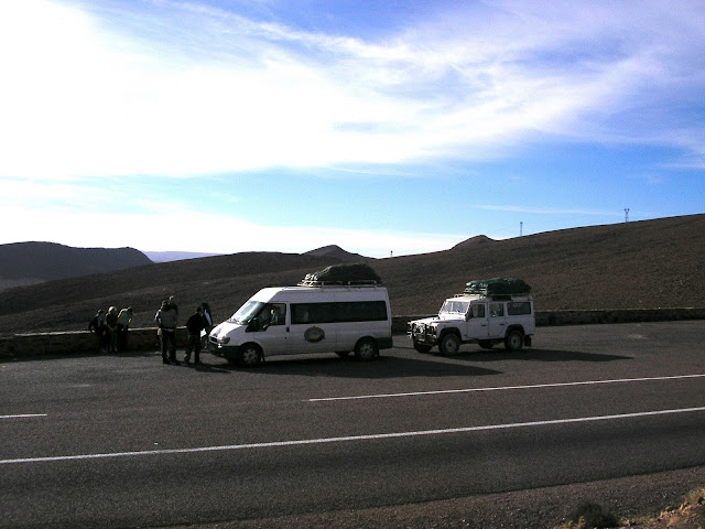A rest stop along highway N9 southeast of Ouarzazate, with our caravan of vehicles and luggage strapped to the roof