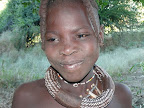 young himba girl near Kunene River Lodge, their job is to chase the vervet monkeys from their mielie field.