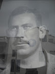 Reflection of the MBA on window of John Steinbeck mural.