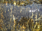 Stream water flowing over granite.