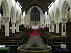 Central asile showing the Altar, Pulpit, Organ & Choir Pews. In the forground is the font. Central asile showing the Altar, Pulpit, Organ & Choir Pews. In the forground is the font.