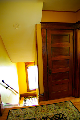 Looking from the 2nd floor bathroom toward the stair well - the closed door leads up to the master bedroom