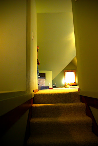 Looking up into the master bedroom from the stair landing.