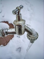 [frozen faucet with the ice and snow in background[9].jpg]