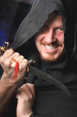 [medieval looking menacng man with dagger wearing black cloak with hood[10].jpg]