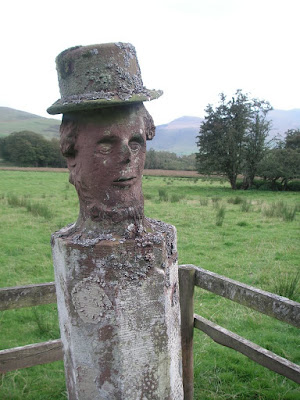 Stone man in a hat