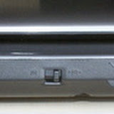 The front of the laptop has the speakers, the status indicator LEDs, the wireless switch which toggles both the Wifi and the Bluetooth, the microphone and headphone slots and a multi card reader