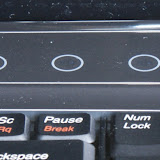 These capacitive buttons towards the top of the keyboard control the volume