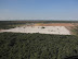 Mine infrastructure and plant area with tailings' dam to the rear.