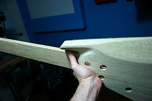 The back of the upper extension is carved away slightly for access, but left thick enough for mounting the strap buttons.