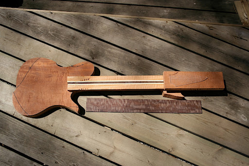 Proto 3 AMX parts roughed out. Figured mahogany body, 5-piece laminate neck (9 if you include the veneers), figured katalox fretboard.
