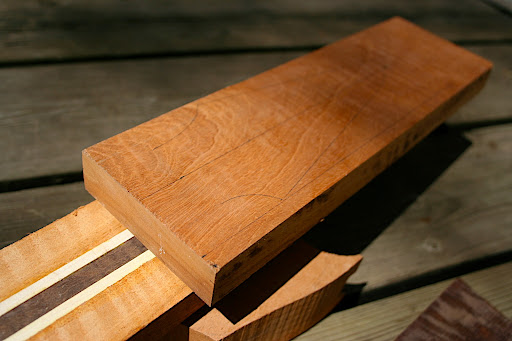 Figured mahogany headstock will be grafted on at the scarf joint.
