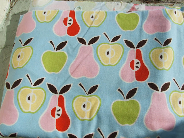 trimmed with a brown fabric with bright butterflies on it