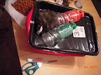 Dishtub cuke materials : new dishtub, paint tray liner, shower scrubby ($4.72 with tax), leftover hydroton, recycled drink bottles. Tools.