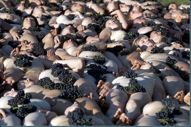 700 people naked to fight climate change

Fuissé, Burgundy, 3rd October 2010. On the initiative of Greenpeace France and world-famous artist Spencer Tunick, 700 volunteers pose nude in a human installation in a vineyard in the south of Burgundy. The impacts of climate change are already being felt all around the world. In France, they are affecting the wines and the vineyards. These installations are an intense illustration of the vulnerability of humankind and its culture to climate change.
With only 80 days left before the Climate Conference in Copenhagen, in this extremely important year for the future of the Earth, Greenpeace, Spencer Tunick and all the volunteers who participated in this unique installation hope it will help raise awareness and put pressure on leaders to act now !