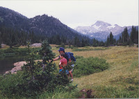 Me and dad in the vally before Eagle Cap peak in the Lostine mountains in eastern Oregon. I remeber this three or four day hike very well, except that in my memories I was way bigger and looked more grown up. My dad and I had snuck up near the bank of this creek to watch the fish; right then the bugs were out and so many little fish were biting the surface of the water that they looked like raindrops.