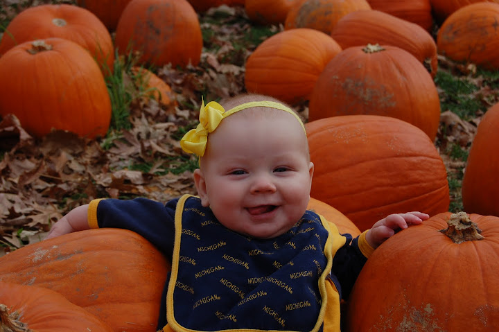 Baby in pumpkins