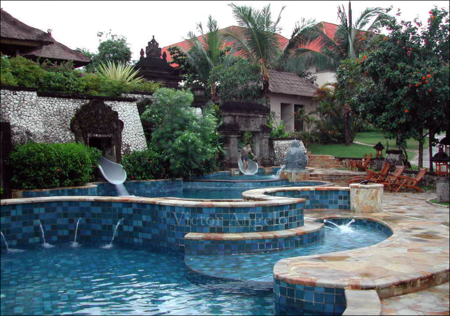 Victor Angelo jumping from the waterslide into the pool