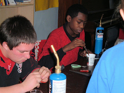 James Ray and Patrick Howard, two neighborhood youth, making pendants during a silversmith class taught by Jerry Day at the Goodlife Center. James Ray and Patrick Howard, two neighborhood youth, making pendants during a silversmith class taught by Jerry Day at the Goodlife Center.