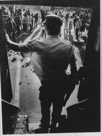 [OosthuysenPierrephotographedAfrikanerCopFacingAngryCrowdCrossroadsCT1989LifeInsideTheCasspirSeries[6].jpg]
