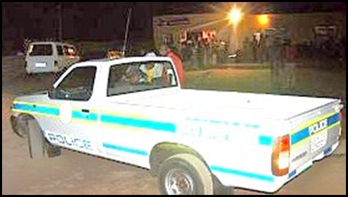 Police vehicle parked outside shebeen _township pub Beeld Chris Louw De Wildt journalist