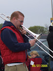 Photo: Andy plays his trombone for the crowd.