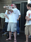 Photo: Rob adds a little extra to his solo with the brass band.