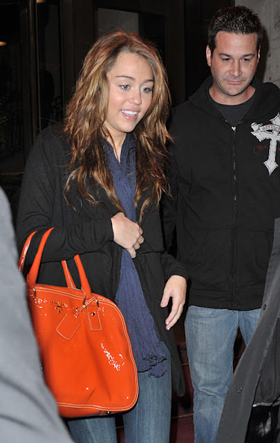 28973, NEW YORK, NEW YORK - Friday, March 6, 2009. Singer Miley Cyrus walks to a waiting SUV as she exits her Midtown hotel in NYC on the way to a live radio performance on Z100. Photograph: Edward Opinaldo, PacificCoastNews.comÊ***FEE MUST BE AGREED PRIOR TO USAGE*** UK OFFICE:Ê+44 131 557 7760/7761/7762ÊUS OFFICE:Ê1 310 261 9676