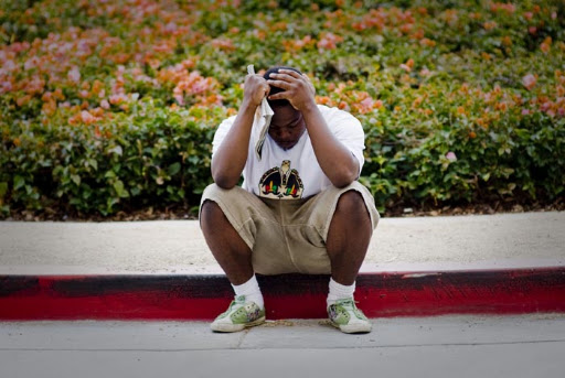 LOS ANGELES - JUNE 25: Kelvin Martinez, of Beaumont, sits outside the UCLA medical Center mourning the death of Michael Jackson on June 25, 2009 in Los Angeles, California. Jackson, 50, the iconic pop star, died after going into cardiac arrest in a hospital today in Los Angeles, California. (Photo by Michal Czerwonka/Getty Images) *** Local Caption *** Kelvin Martinez