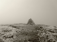 The final cairn on the peak. Photo