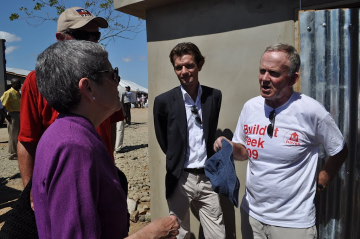 A conversation about the design of the buildings broke out while we toured the homes.  From l to r, Anne Hastings, the Director of Fonkoze (www.fonkoze.org); Hugh Brennan, CEO of the Haven Project; Maarten Boute, CEO of Digicel; and Leslie Buckley, Founder of Haven and Vice-Chairman of Digicel.