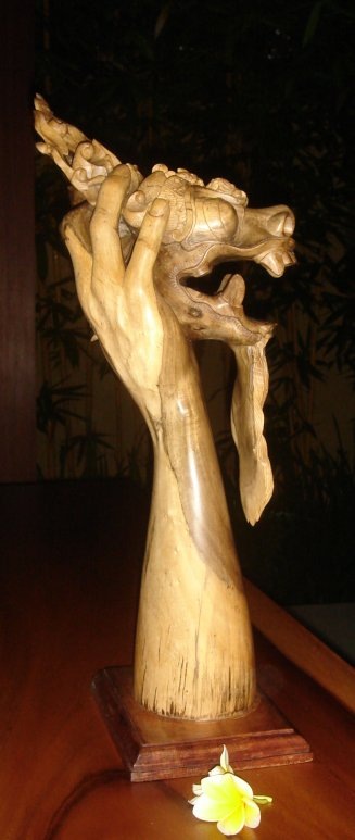 wooden statue of a barong mask in one of the best yoga retreats in Ubud, Bali