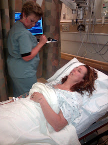 Trish, almost passed out, during the botched needle attempts.