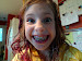 Lily grabs the camera for a quick picture of her sister, who poses artfully.