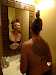 Trish checks out her hair and likes it!