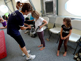 Lily and Emma get their saftey harness on to start the class.