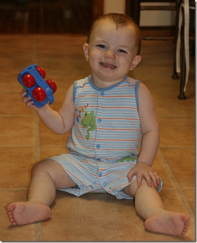 Playing with cars in the kitchen.