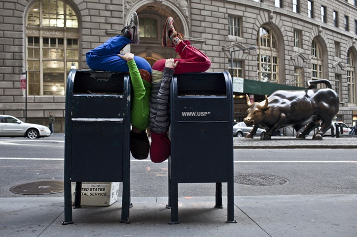 Performers situate themselves into position during a piece entitled 