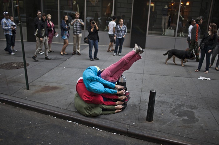 Performers situate themselves into position during a piece entitled "Bodies in Urban Spaces" by choreographer Willi Dorner. Starting at sunrise, the performers inched their way into different spaces throughout lower Manhattan.CREDIT: Bryan Derballa for The Wall Street JournalNYBODIES Performers situate themselves into position during a piece entitled "Bodies in Urban Spaces" by choreographer Willi Dorner. Starting at sunrise, the performers inched their way into different spaces throughout lower Manhattan.CREDIT: Bryan Derballa for The Wall Street JournalNYBODIES