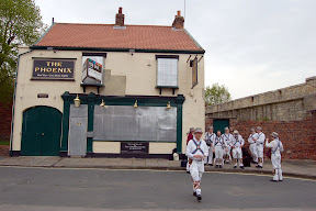 Morris Men outside boarded up Phoenix pub