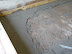 Care is taken to make sure the mesh is well embedded in the plaster