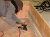 The form box includes temporary sides, which house the permanent window stud and mesh